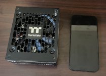 Thermaltake Toughpower SFX 1000W fan next to iphone 13.jpg Thermaltake Toughpower SFX 1000W fan next to iphone 13.jpg
